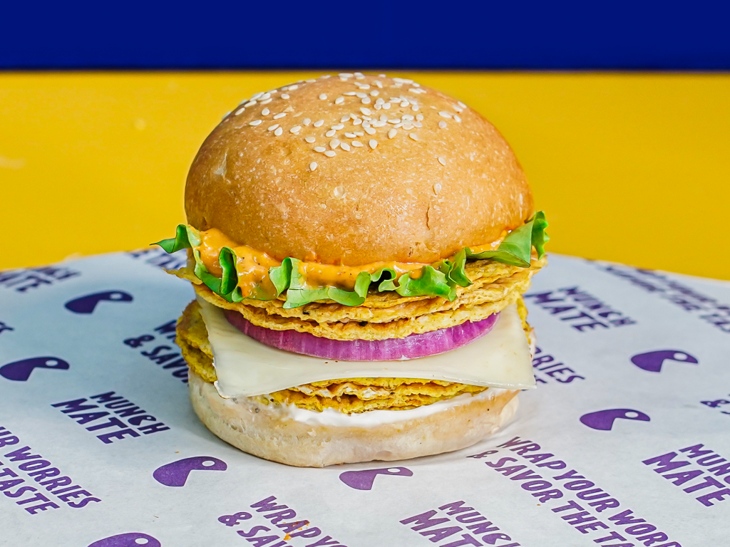 delicious juicy burger with fresh ingredients on a purple background, food photography, high resolution